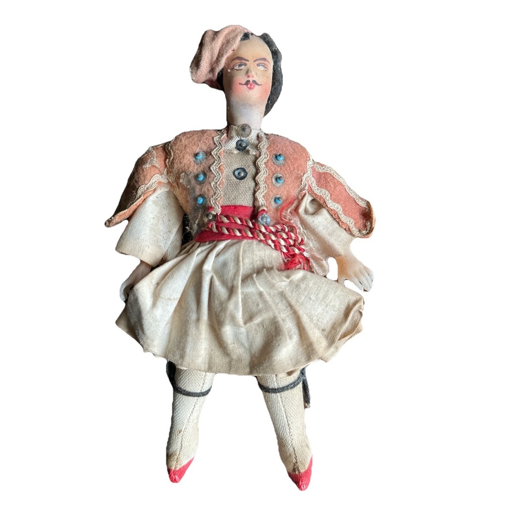 A vintage doll in‎ a man's Greek costume. 1960s
